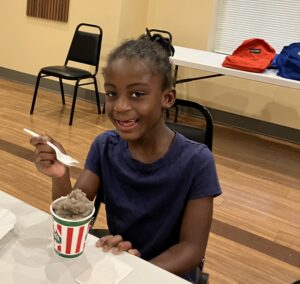 student eating water ice