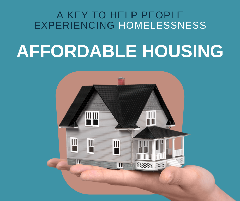An image of a house in a person's hands